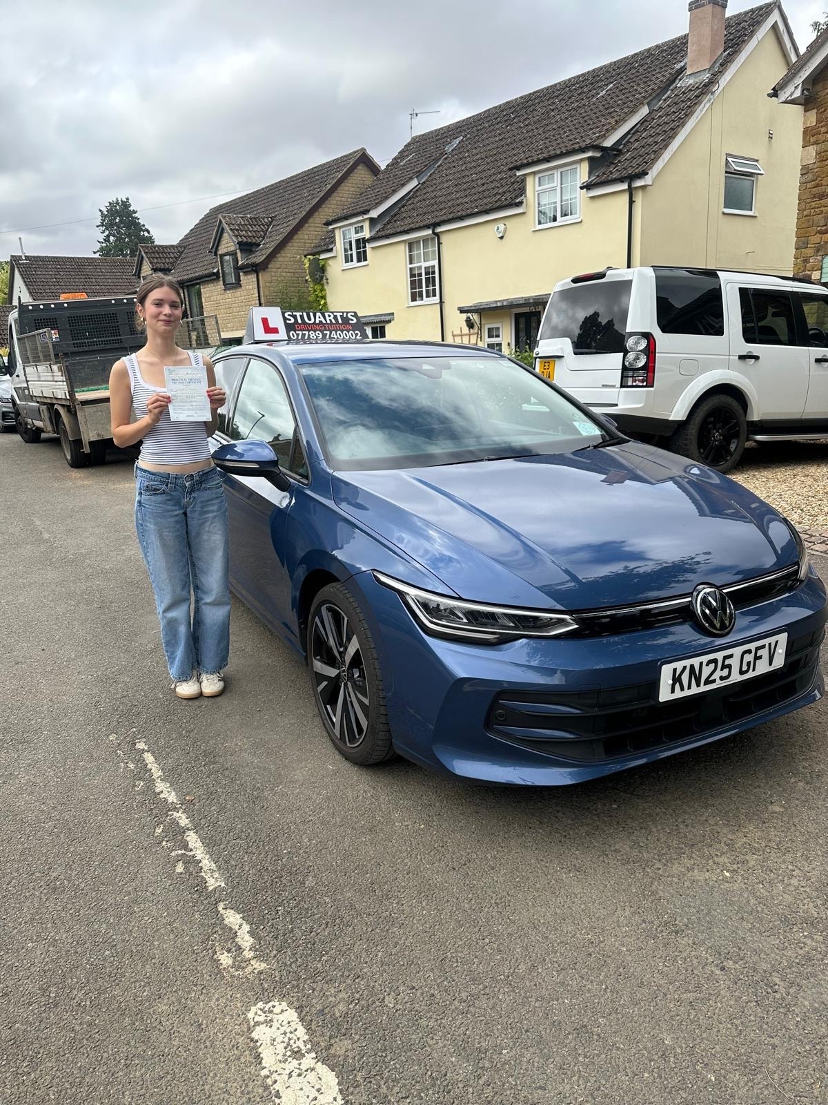 Learner driver celebrating passing their driving test